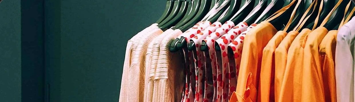 A rail of garments photographed for an e-commerce catalog